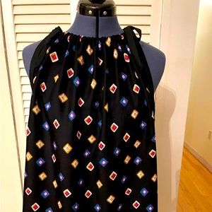 Beautiful sleeveless black multi colored design top.